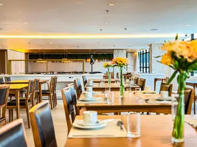 Um restaurante ou outro lugar para comer em Blue Sea Hotel Suite Luxo Frente Mar