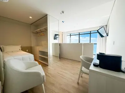 Uma cama ou camas num quarto em Blue Sea Hotel Suite Luxo Frente Mar