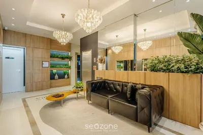 Uma área de estar em Apartamentos Completos a 700m da Praia - VNV
