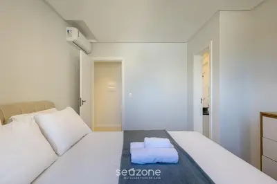 Uma cama ou camas num quarto em Apartamentos Completos a 700m da Praia - VNV