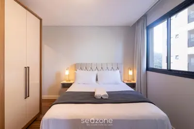 Uma cama ou camas num quarto em Apartamentos Completos a 700m da Praia - VNV