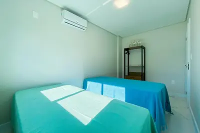 Uma cama ou camas num quarto em Praia de Palmas Conforto a 450m do mar 0193