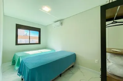 Uma cama ou camas num quarto em Praia de Palmas Conforto a 450m do mar 0193