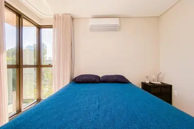 Uma cama ou camas num quarto em Praia de Palmas Conforto a 450m do mar 0193