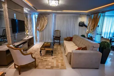 Uma área de estar em Apt 3 en-suites - Meia Praia