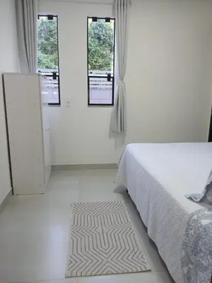 Uma cama ou camas num quarto em Casa Mar à Vista - Jacuzzi - Cinema - Sinuca