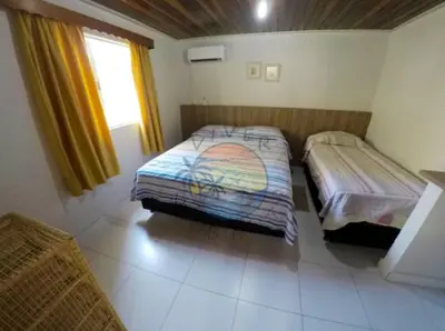 Uma cama ou camas num quarto em Casa Ampla Zona Central da Praia com 04 Dormitórios