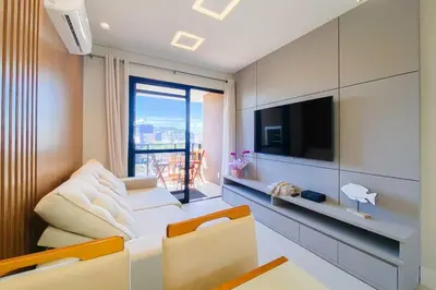 Uma televisão e/ou sistema de entretenimento em Conforto e exclusividade a 60m da Praia de Palmas 0321