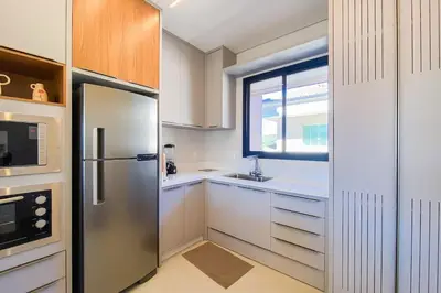 A cozinha ou kitchenette de Conforto e exclusividade a 60m da Praia de Palmas 0321