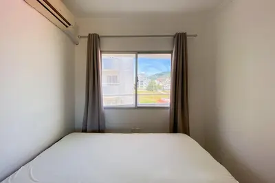 Uma cama ou camas num quarto em Apartamento com 03 quartos na Praia! 0331