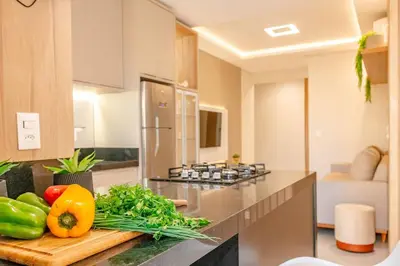 A cozinha ou kitchenette de Belissimo apartamento com vista da praia em Bombas