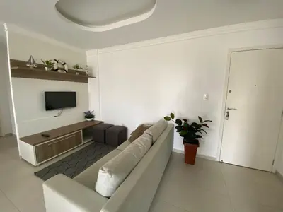 Uma televisão e/ou sistema de entretenimento em Vista Mar - Praia de Palmas - 80m da Praia - Piscina e Lazer Completo! 0475