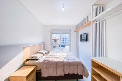 Uma cama ou camas num quarto em Praia de Palmas - Apto 300m da Praia, 2 Dorms - 0158