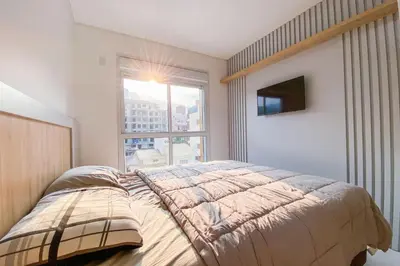 Uma cama ou camas num quarto em Praia de Palmas - Apto 300m da Praia, 2 Dorms - 0158