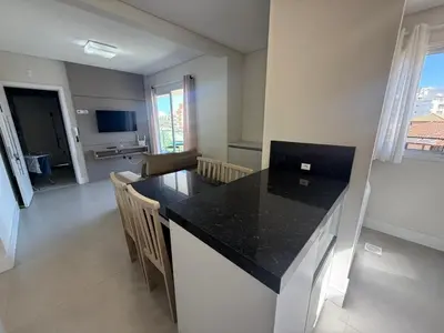 Uma televisão e/ou sistema de entretenimento em cód 152 - Excelente apartamento á 300m do mar!