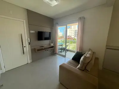 Uma televisão e/ou sistema de entretenimento em cód 152 - Excelente apartamento á 300m do mar!