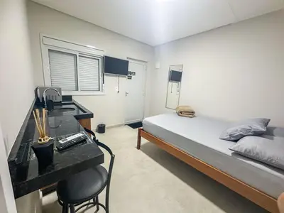 Uma cama ou camas num quarto em Praia de Palmas, Estúdio Aconchegante 700m do Mar - 0187