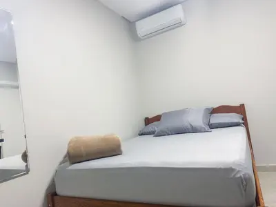 Uma cama ou camas num quarto em Praia de Palmas, Estúdio Aconchegante 700m do Mar - 0187