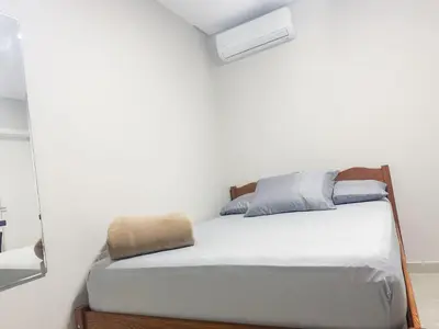 Uma cama ou camas num quarto em Praia de Palmas, Estúdio Aconchegante 700m do Mar - 0187