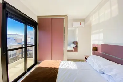 Uma cama ou camas num quarto em Apto 2 Quartos sendo 1 Suíte bem localizado - 0329