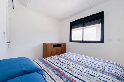 Uma cama ou camas num quarto em Apartamento Frente Mar! 0344