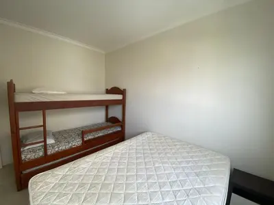 Uma cama ou camas num quarto em Praia de Palmas - 400 metros da praia - Amplo e Aconchegante - 0461