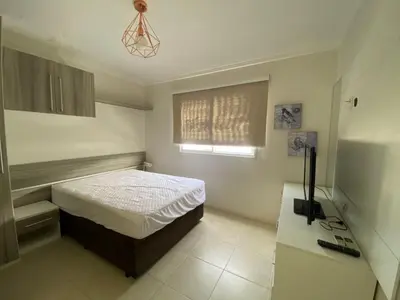 Uma cama ou camas num quarto em Praia de Palmas - 400 metros da praia - Amplo e Aconchegante - 0461