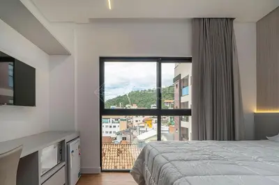 Uma cama ou camas num quarto em 404 Suíte em Localização Incrível Praia de Bombinhas a 120m