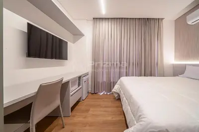 Uma cama ou camas num quarto em 404 Suíte em Localização Incrível Praia de Bombinhas a 120m
