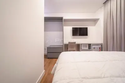Uma cama ou camas num quarto em 404 Suíte em Localização Incrível Praia de Bombinhas a 120m