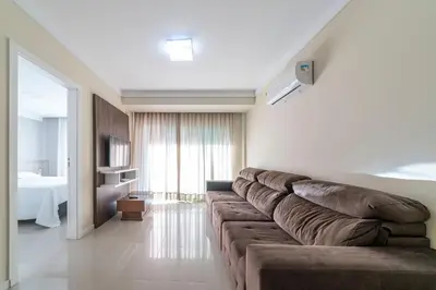 Uma área de estar em Curaçao 201 - Cobertura duplex com jacuzzi privativa - 50 metros da Praia de Canto Grande!
