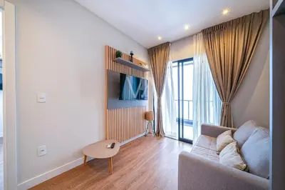 Uma televisão e/ou sistema de entretenimento em 206- Apart c/ churrasqueira e piscina