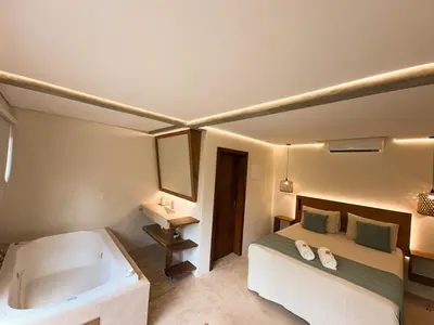Uma cama ou camas num quarto em Refúgio Aconchegante em Mariscal - Baoba Suítes