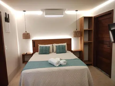Uma cama ou camas num quarto em Refúgio Aconchegante em Mariscal - Baoba Suítes