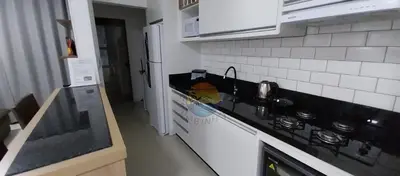 A cozinha ou kitchenette de Apartamento próximo a praia e comércio em geral com 03 Dormitórios