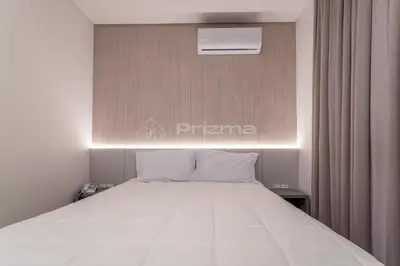 Uma cama ou camas num quarto em 405 Suíte em Localização Incrível Praia de Bombinhas a 120m