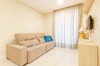 Uma televisão e/ou sistema de entretenimento em Apartamento a 200 Metros da Praia de Bombinhas