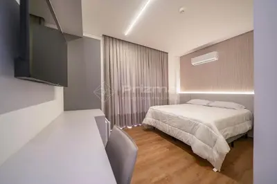 Uma cama ou camas num quarto em 408 Suíte em Localização Incrível Praia de Bombinhas a 120m