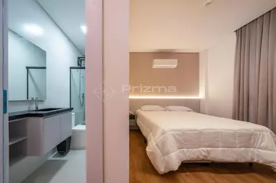 Uma cama ou camas num quarto em 409 Suíte em Localização Incrível Praia de Bombinhas a 120m