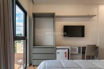 Uma televisão e/ou sistema de entretenimento em 409 Suíte em Localização Incrível Praia de Bombinhas a 120m