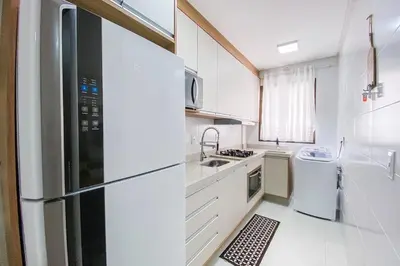 A cozinha ou kitchenette de Apartamento para relaxar 450m da Praia de Palmas - 0113