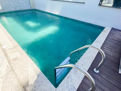 A piscina em ou perto de Apartamento para relaxar 450m da Praia de Palmas - 0113
