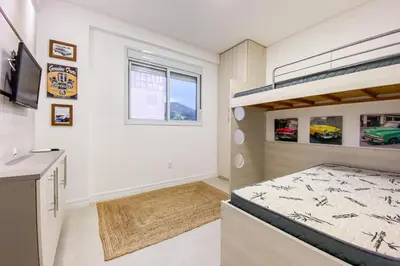 Uma cama ou camas num quarto em Relaxamento e Lazer a 100m da Praia de Palmas - 0127