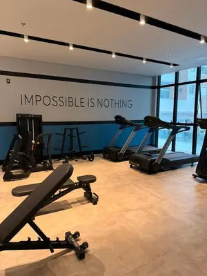 O centro de fitness e/ou as comodidades de fitness de Seu Refúgio de Luxo a Passos do Mar em Itapema