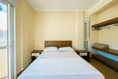 Uma cama ou camas num quarto em Praia de Palmas 400m do mar, perto do comércio - 0198