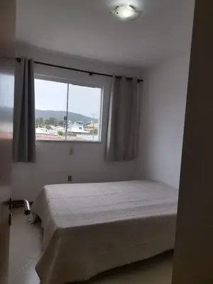 Uma cama ou camas num quarto em Condomínio Jardim das Américas em Bombinhas - Você Merece estar no Paraiso