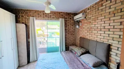 Uma cama ou camas num quarto em Cod 140 - Residencial Torres, Praia de Bombas ap 5