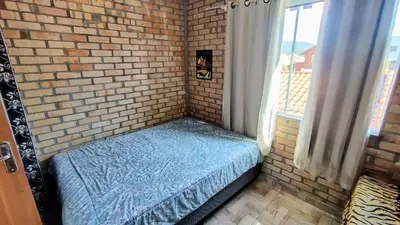 Uma cama ou camas num quarto em Cod 140 - Residencial Torres, Praia de Bombas ap 5