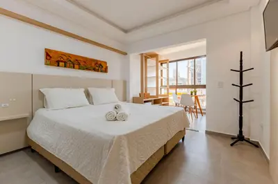 Uma cama ou camas num quarto em Pousada Nalu Bombinhas