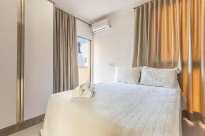 Uma cama ou camas num quarto em Pousada Nalu Bombinhas